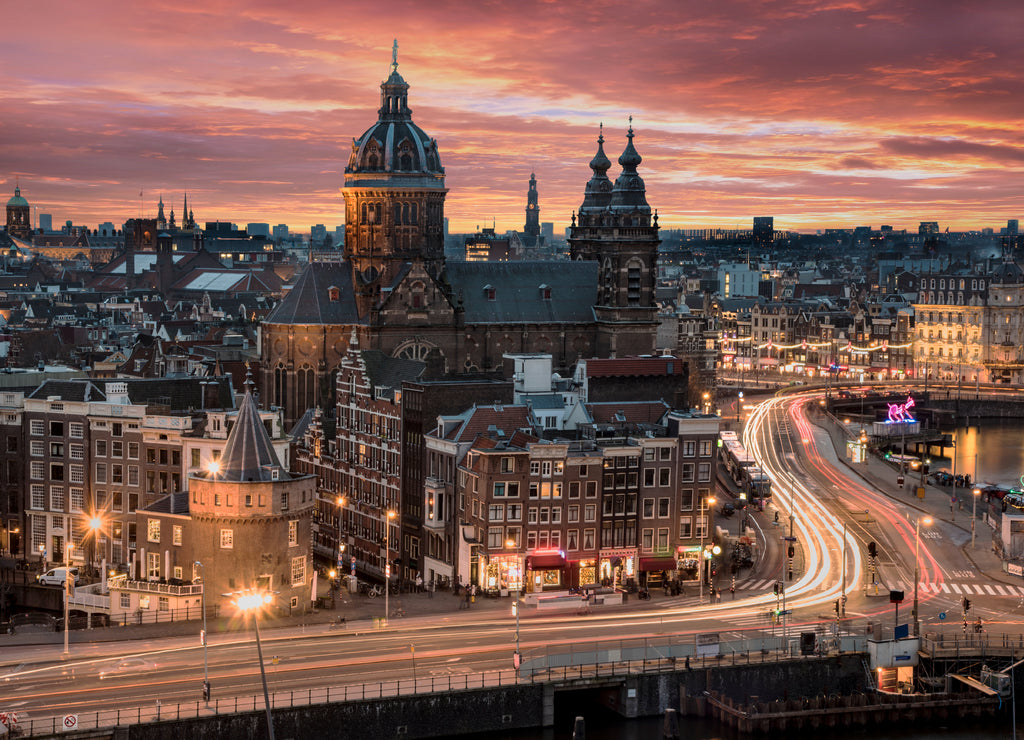 Basilica Saint Nicolas church in Amsterdam sunset skyline with the traffic light trays