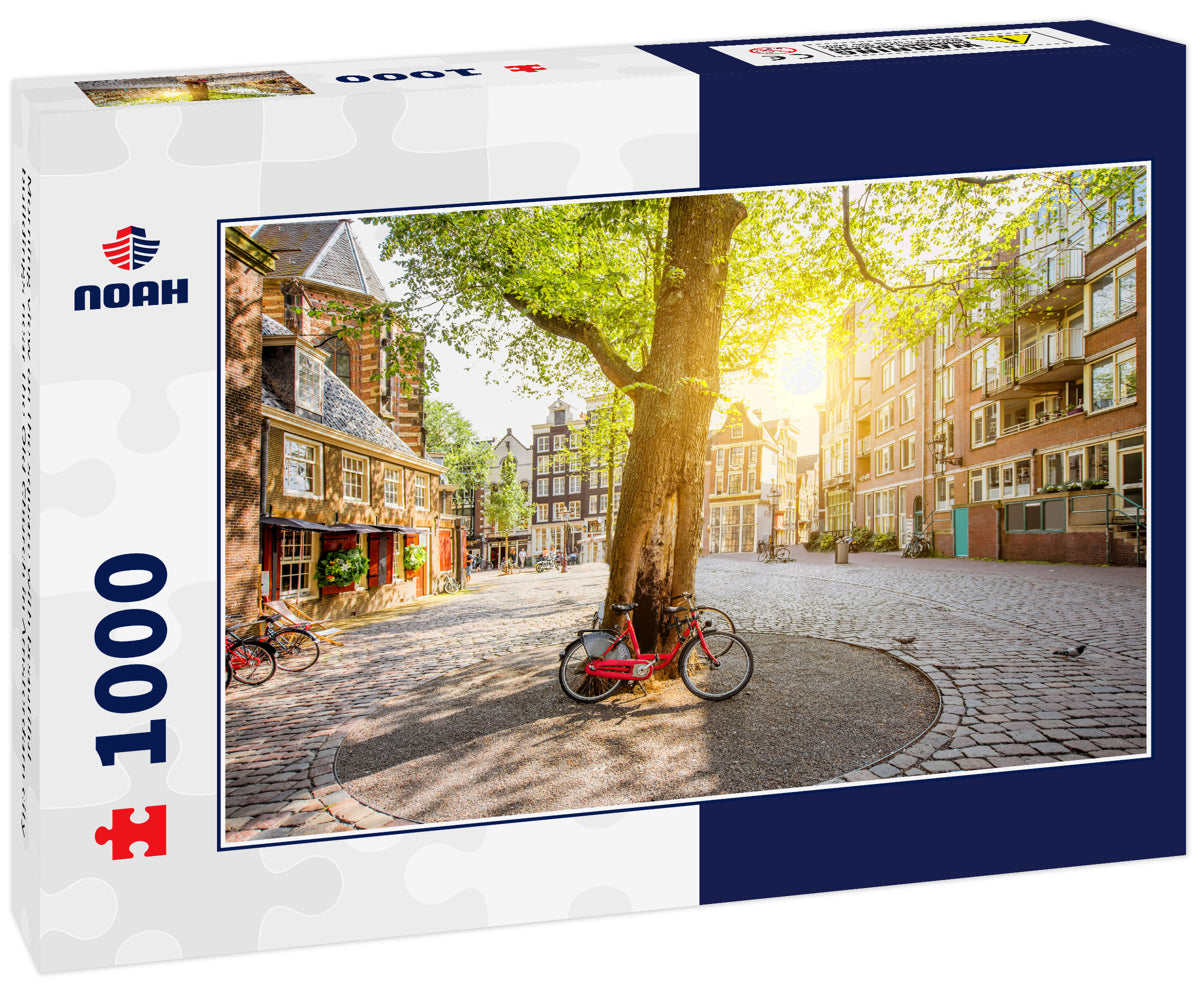 Morning view on the square with beautiful buildings near the Old Church in Amsterdam city