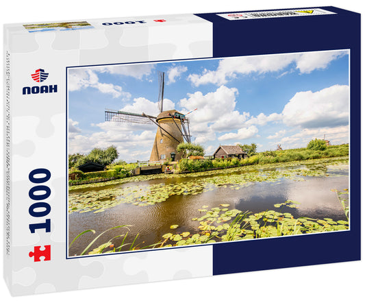 Landscape view on the old windmills during the sunny weather in Kinderdijk village, Netherlands