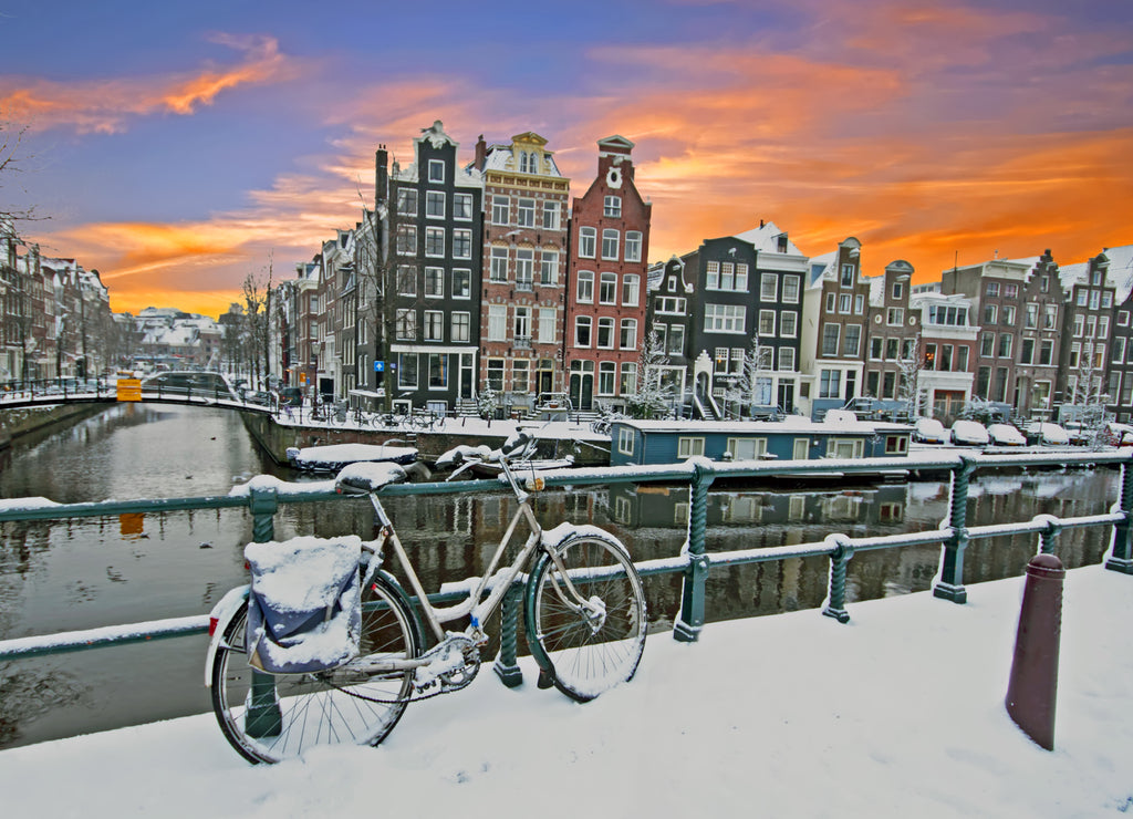 Cityscenic from Amsterdam in winter in the Netherlands at sunset