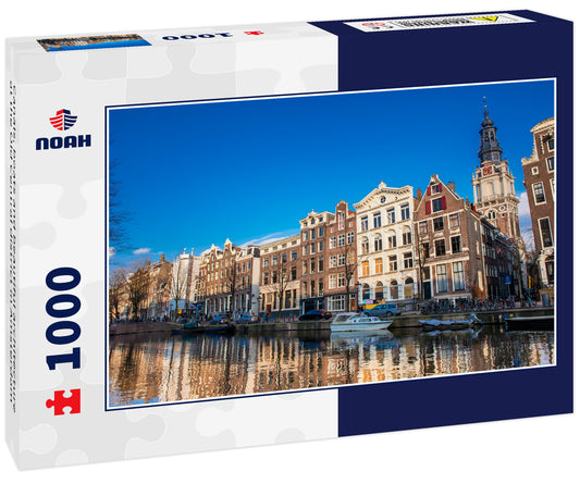 Canals, boats and beautiful architecture at the Old Central district in Amsterdam