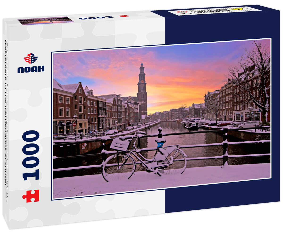 City scenic from snowy Amsterdam with the Westerkerk in the Netherlands at sunset
