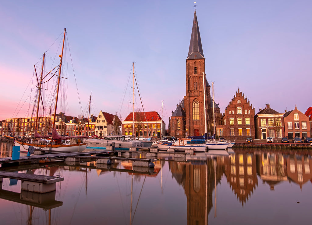 View on St. Michaels church in the city Harlingen in Friesland the Netherlands at sunset