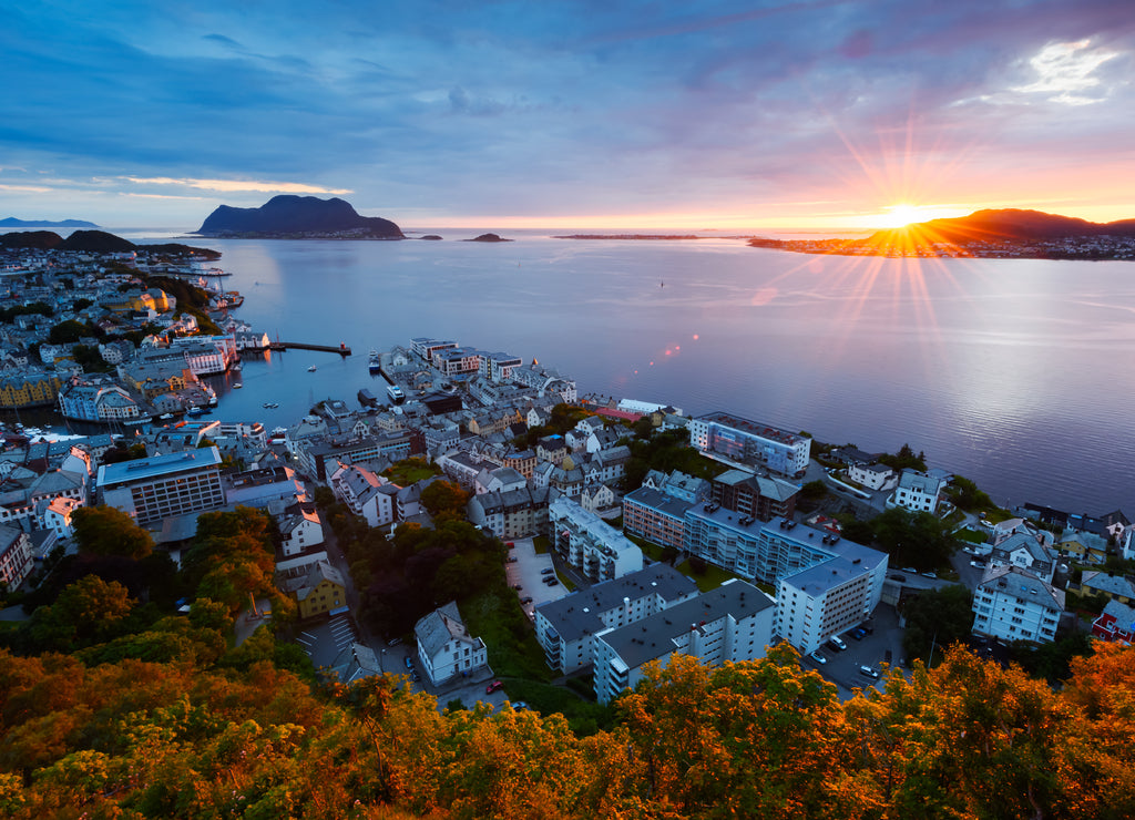 Colorful sunset in Alesund port town on western coast of Norway. Place where the ocean meet the mountains