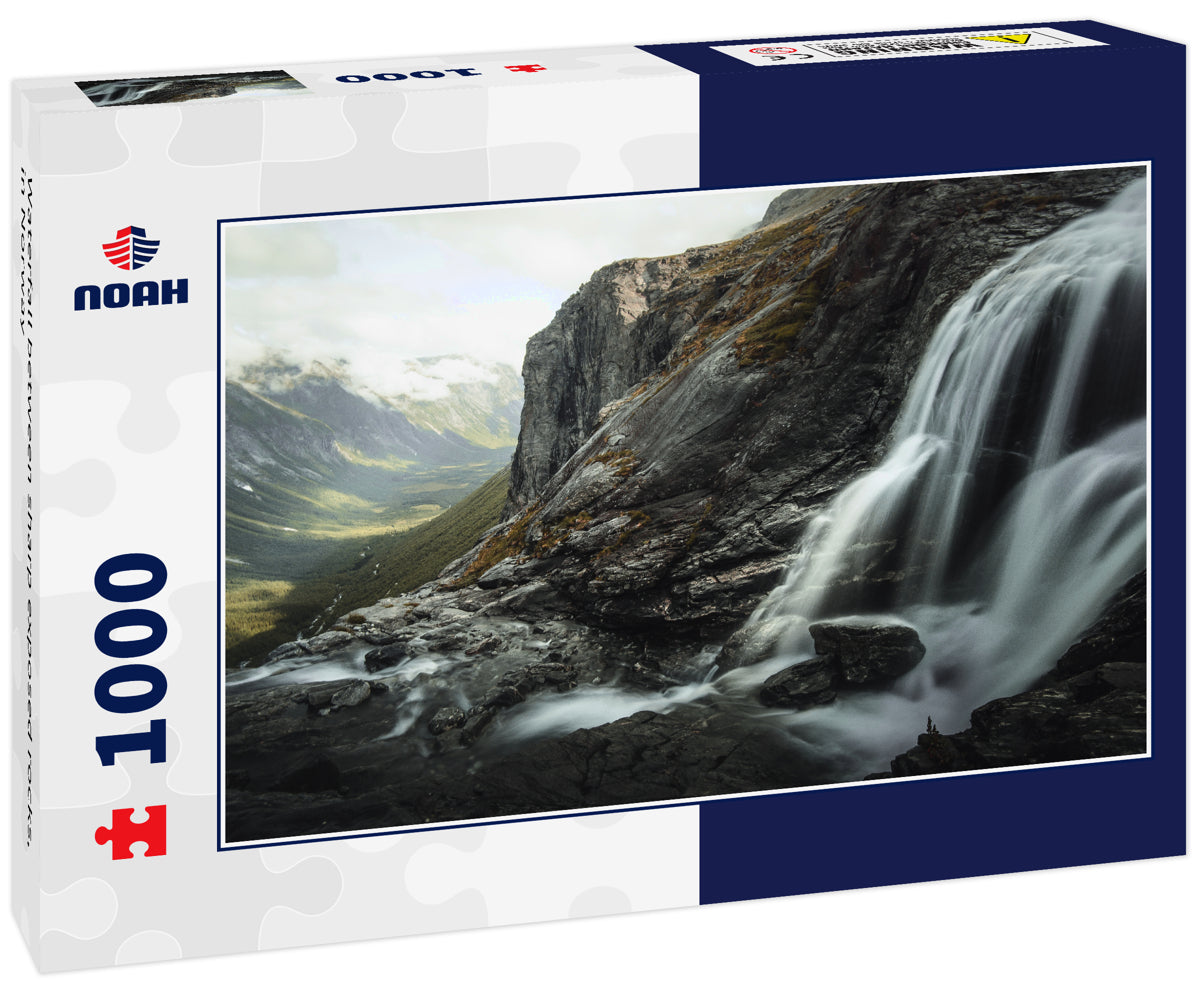 Waterfall between sharp exposed rocks, in Norway