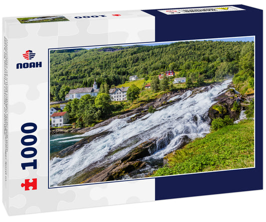 Panorama of small village Hellesylt with Hellesyltfossen waterfall in along Geiranger fjord in More og Romsdal county in Norway