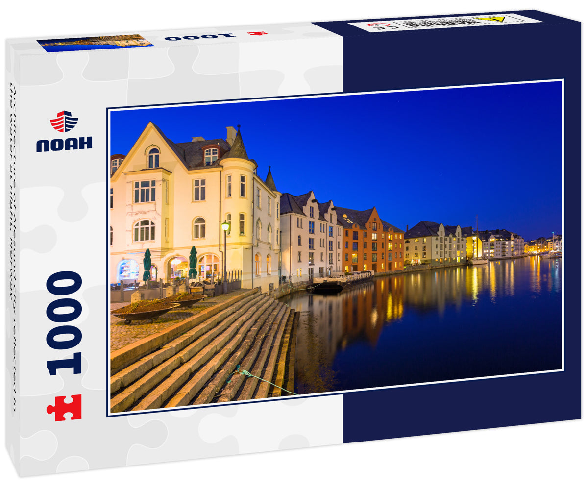 Architecture of Alesund city reflected in the water at night, Norway