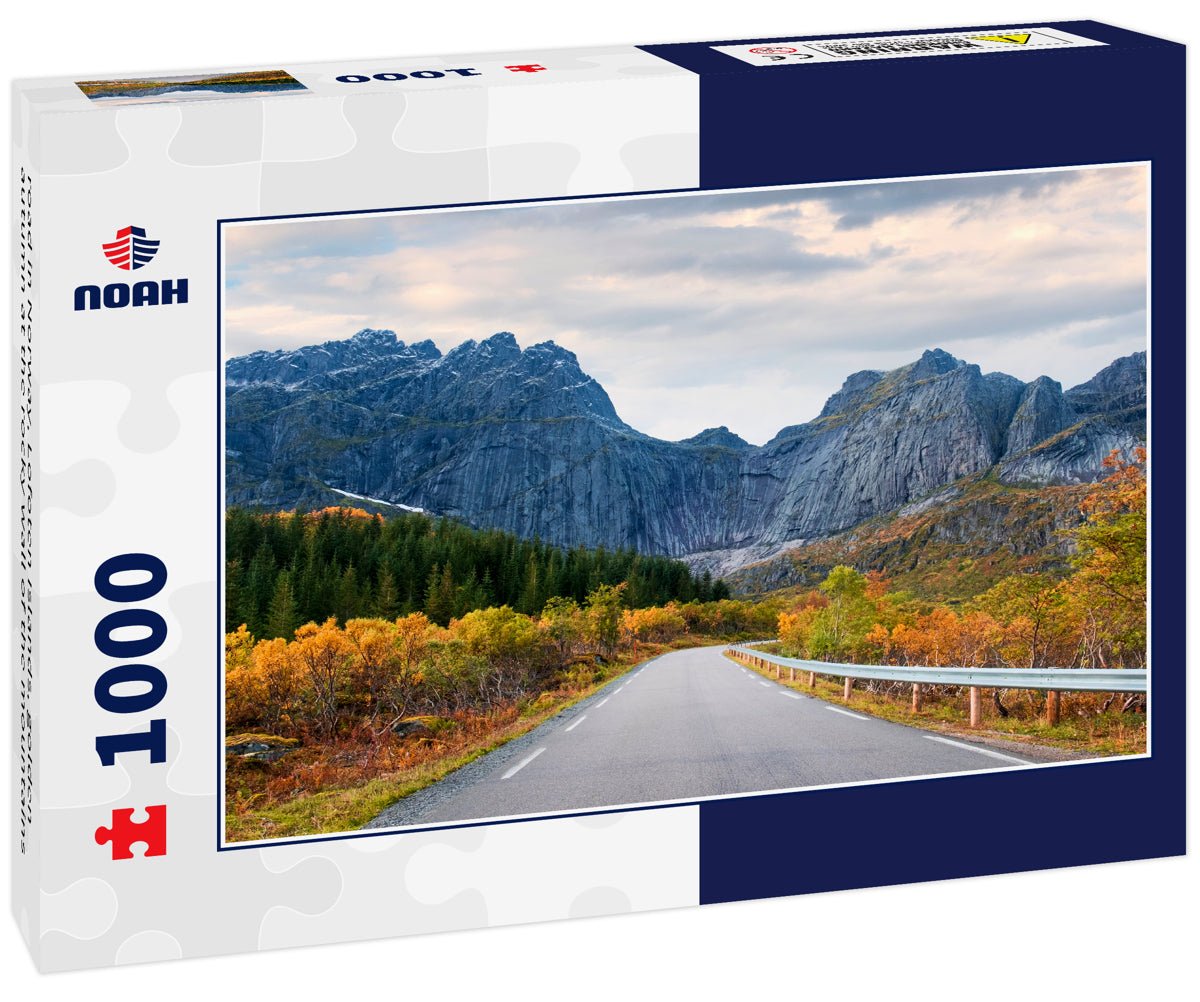 road in Norway, Lofoten Islands, golden autumn at the rocky wall of the mountains