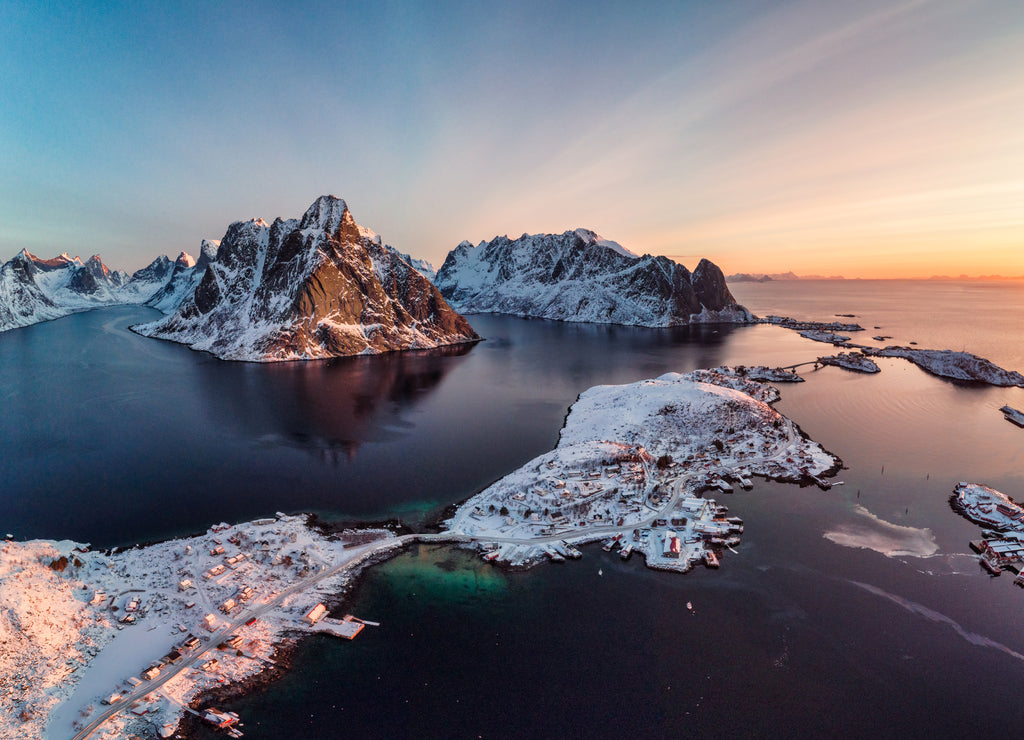 Sunrise on Lofoten island is archipelago with fishing village on coastline in winter at Norway