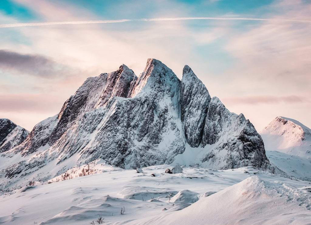 Snowy mount with colorful sky on Segla mountain in Senja island on winter at Norway