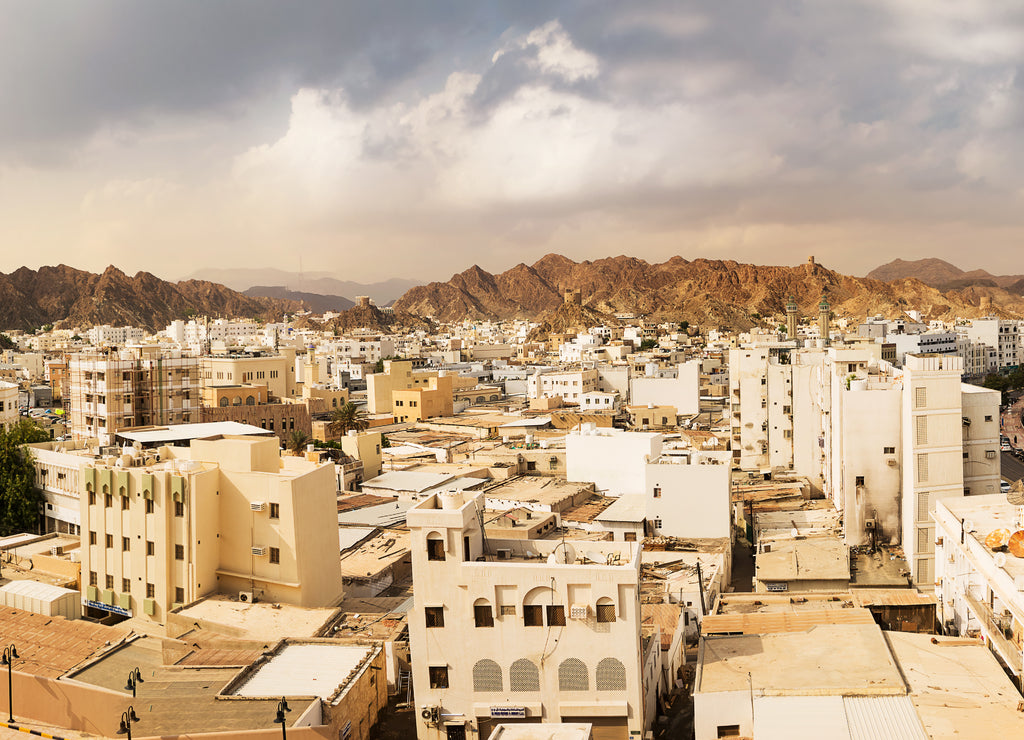 Mutrah waterfront with Mosque in Muscat at sunset and Corniche with nobody