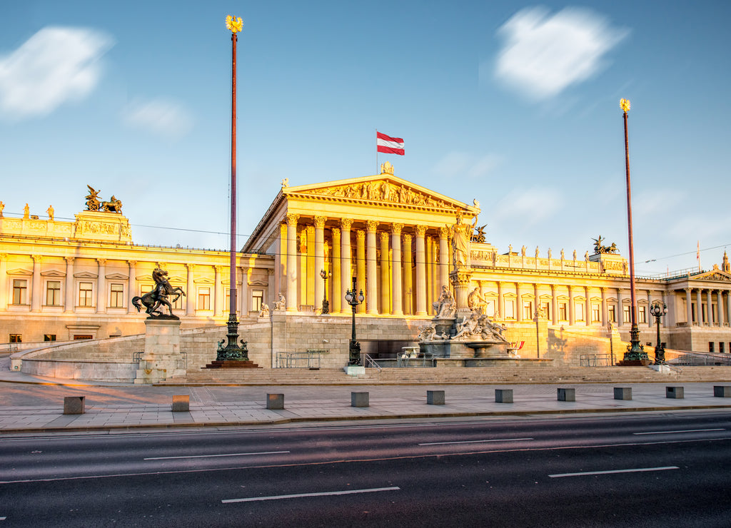 Austrian parliament building with Athena statue on the front in Vienna on the sunrise