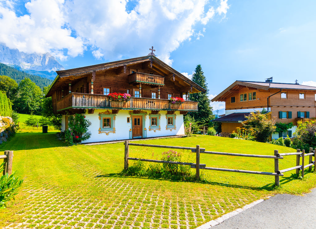 Traditional alpine houses in village of Going am Wilden Kaiser on beautiful sunny summer day, Tirol, Austria