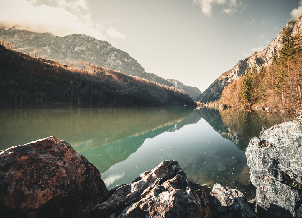 Mountain and lake landscape with reflection during autumn at the Leopoldsteiner See