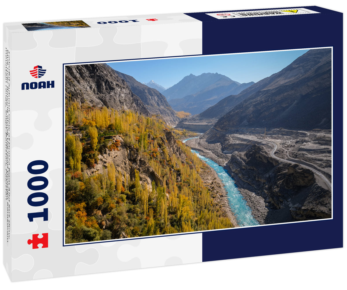 Colorful autumn view of Hunza from Altit fort show blue river flowing along the road through Karakoram mountain range, Gilgit-Baltistan, Pakistan