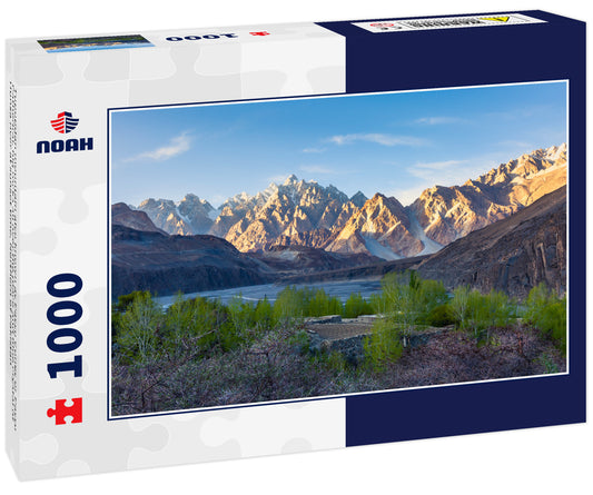 Tupopdan mountain also known as Passu Cones or Passu Cathedral, big rocks all over the place and blue crystal of Hunza river at sunset time, Northern of Pakistan