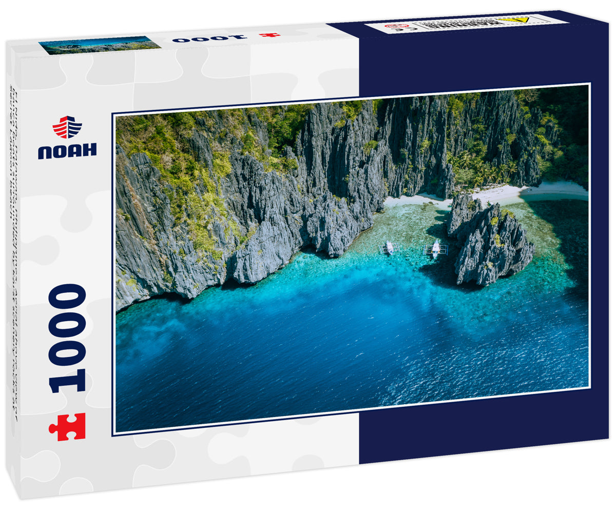 El Nido, Palawan, Philippines. Aerial above view of banca boats surrounded by karst scenery rocks at Secret Lagoon beach