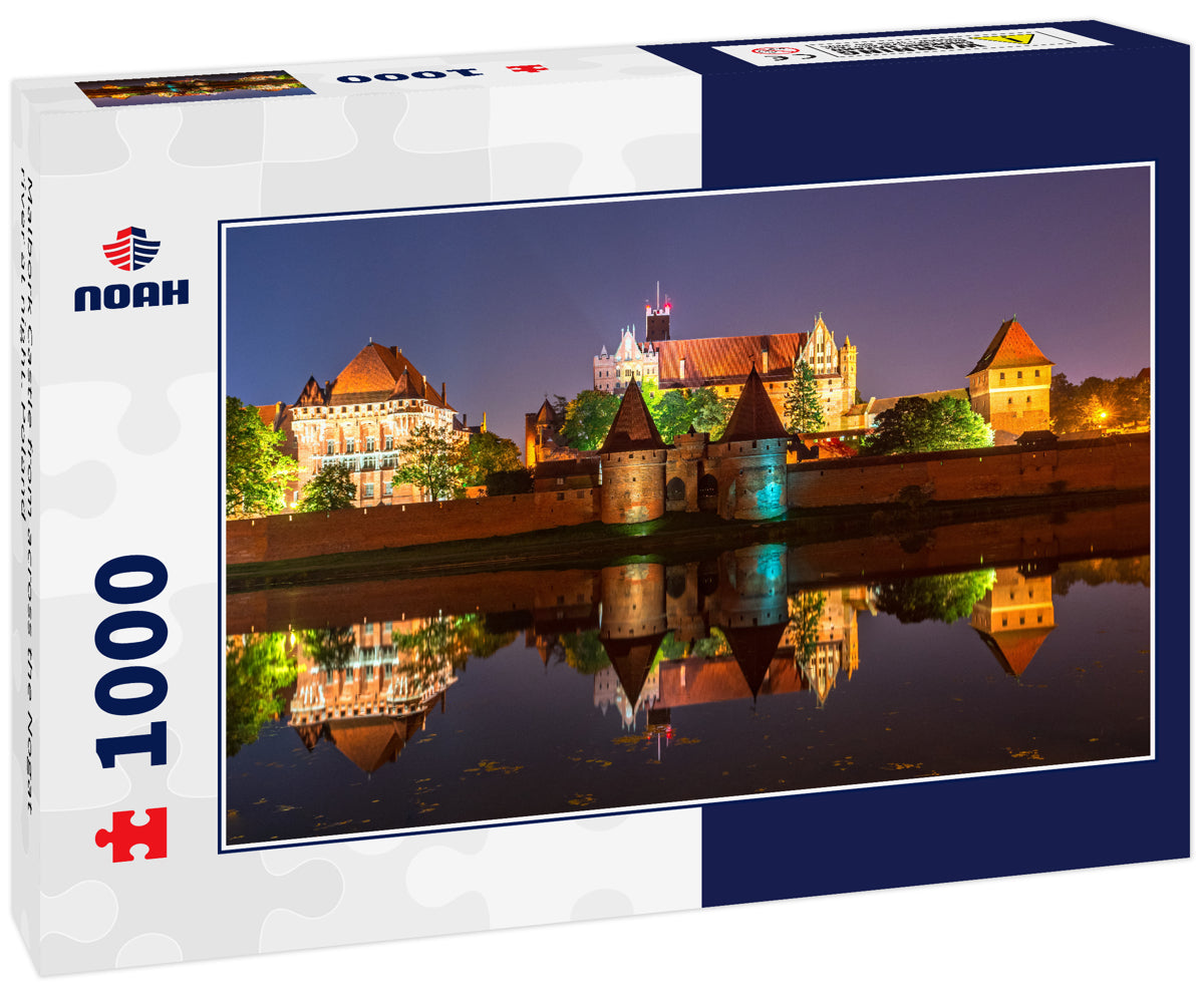 Malbork Castle from across the Nogat river at night. Poland