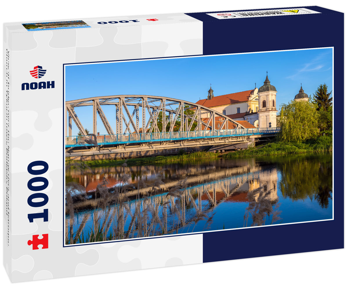 View at bridge over the Narew river and baroque Church in Tykocin town, Podlasie, Poland