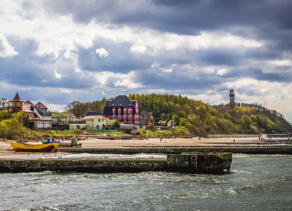 View on the Niechorze, small village on the Baltic coast with lighthouse on background, Poland