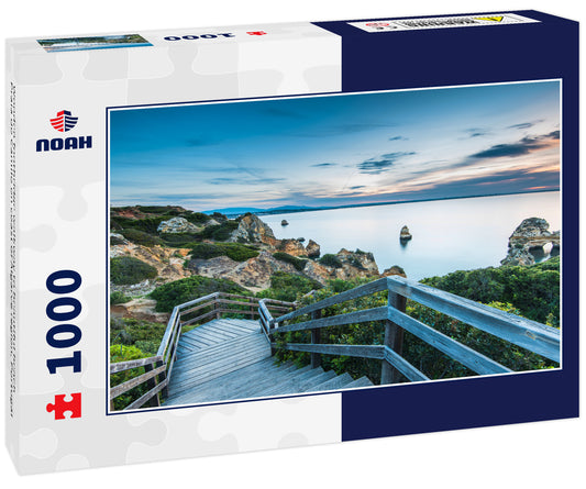 Wooden footbridge walkway to beautiful beach Praia do Camilo on coast of Algarve region, Portugal