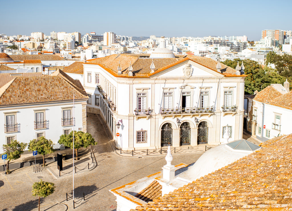 Top cityscape view on the old town with beautiful rooftops in Faro on the south of Portugal