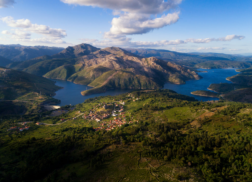 Aerial panoramic view of the historic village of Lindoso, with the surroundings mountains and lake, at the Peneda Geres National Park, in Portugal