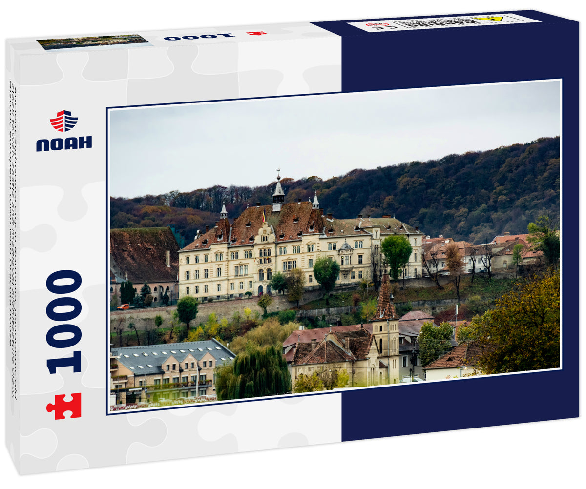 Ancient Sighisoara city in Romania, panoramic old clock tower, castle and medieval architecture view. Historic european town with Dracula house