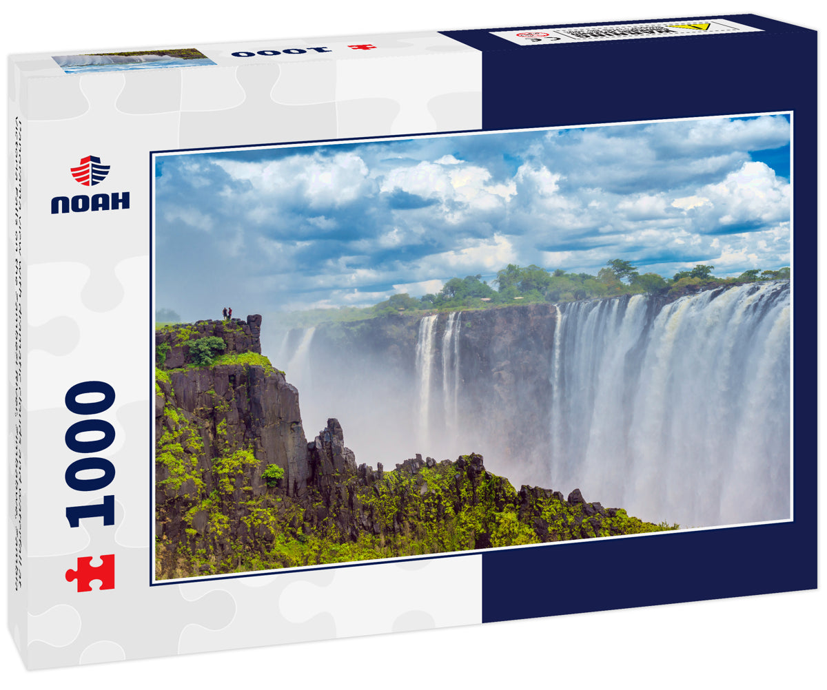 Panorama view with dramatic clouds and waterfall at Victoria Falls on the Zambezi River, Zimbabwe, Zambia