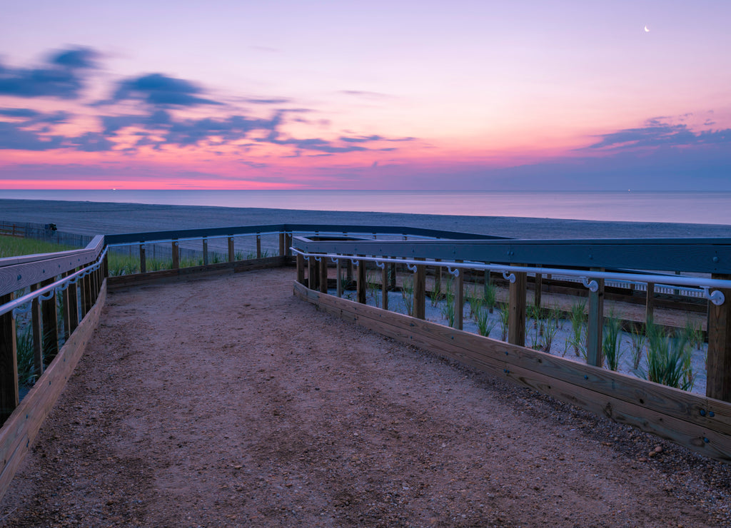 Beautiful sunrise over Lavallette Beach, New Jersey featuring sand on the foreground and sunny sky on the background