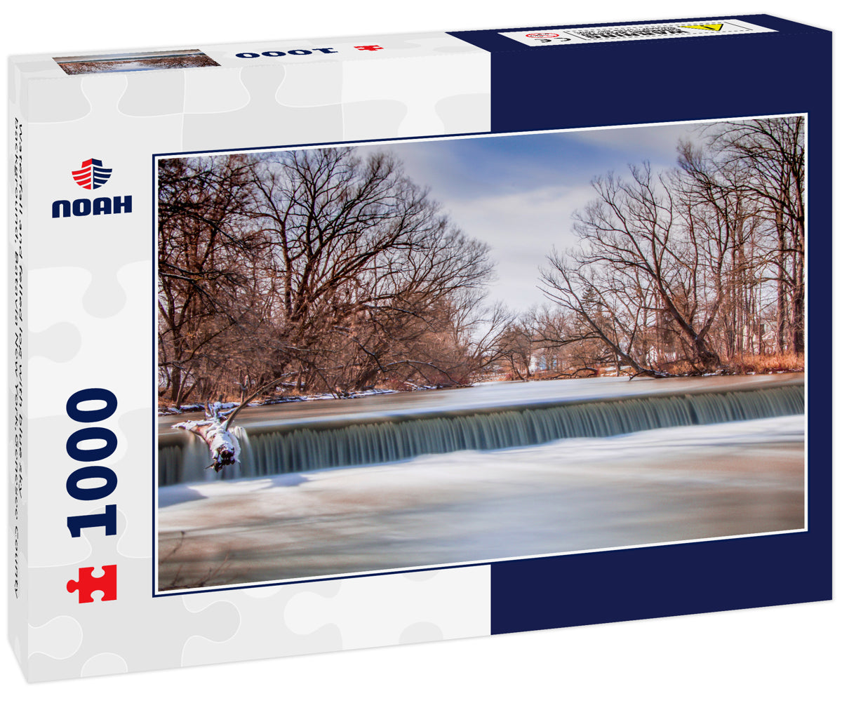 Waterfall and felled log with blue sky background, Batavia New York,Genesee County