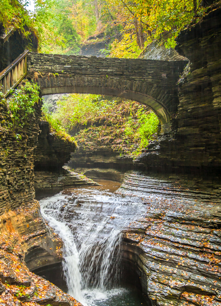 A stone bridge and waterfall in Watkins Glen State Park. It is located outside the village of Watkins Glen, south of Seneca Lake in Schuyler County in New York's Finger Lakes regio