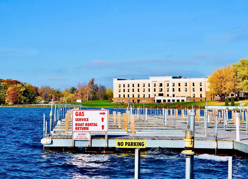 Marina public boat dockage on Keuka Lake in Penn Yan, Finger Lakes region, New York. Lakeshore scene on a sunny autumn day