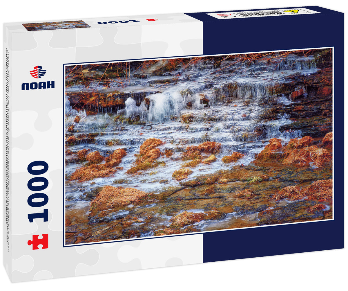 waterfall in spring forest. Small ice waterfalls on the edge of a creek in Binghamton in Broome County in Upstate New York. Snow has melted but the frozen water still remains on the rock ledges