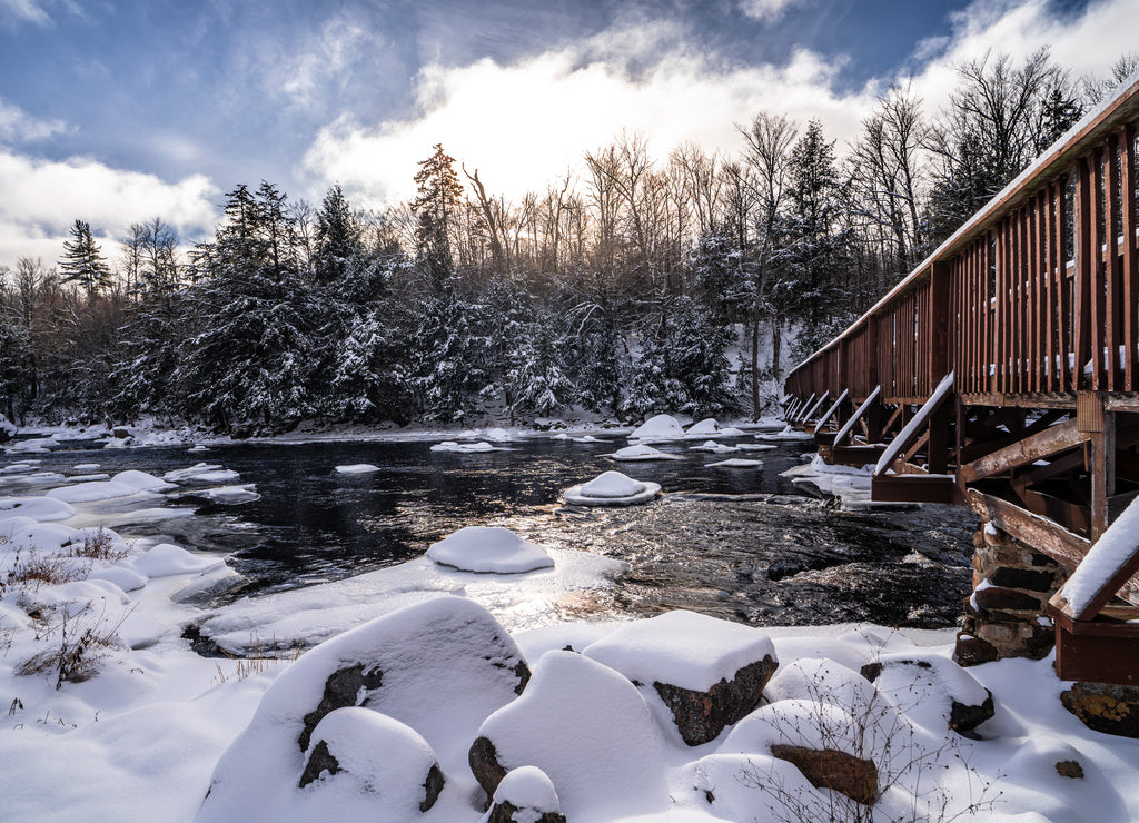 Saint Regis bridge surrounded by snow-covered trees in Waverly, Franklin County, New York