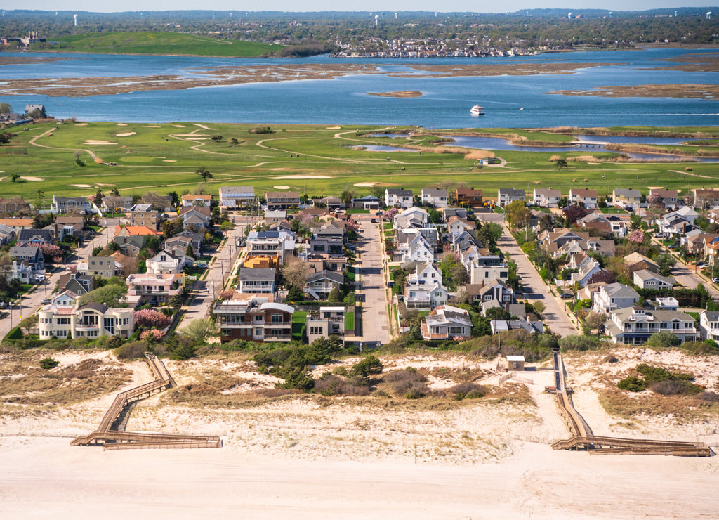 Aerial view over Nassau County on Long Island New York with community of homes in view