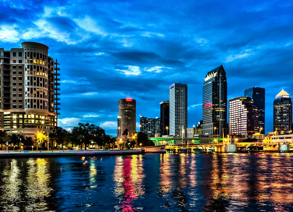 The skyline of downtown Tampa after sunset with Hillsborough river in the foreground, Florida