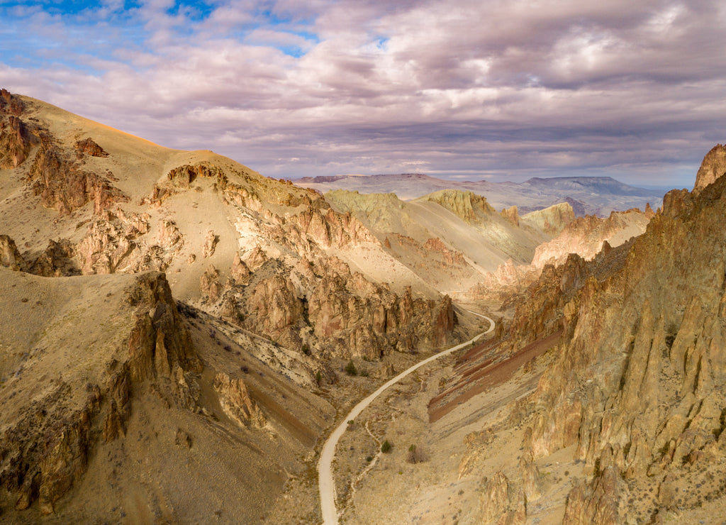 Winding dirt road heads to the Owyhee reservoir in Oregon