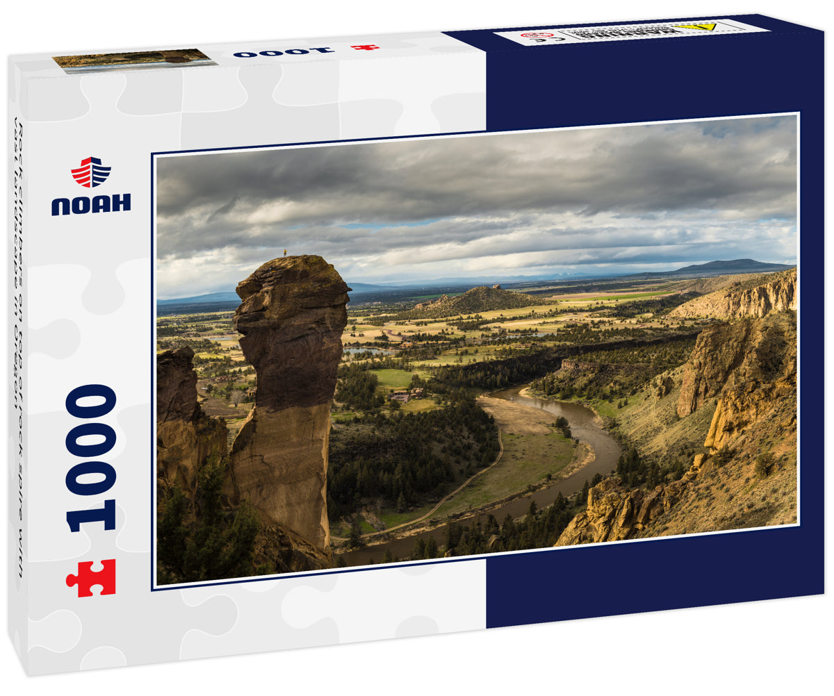 Rock climbers on top of rock spire with vast landscape in Oregon