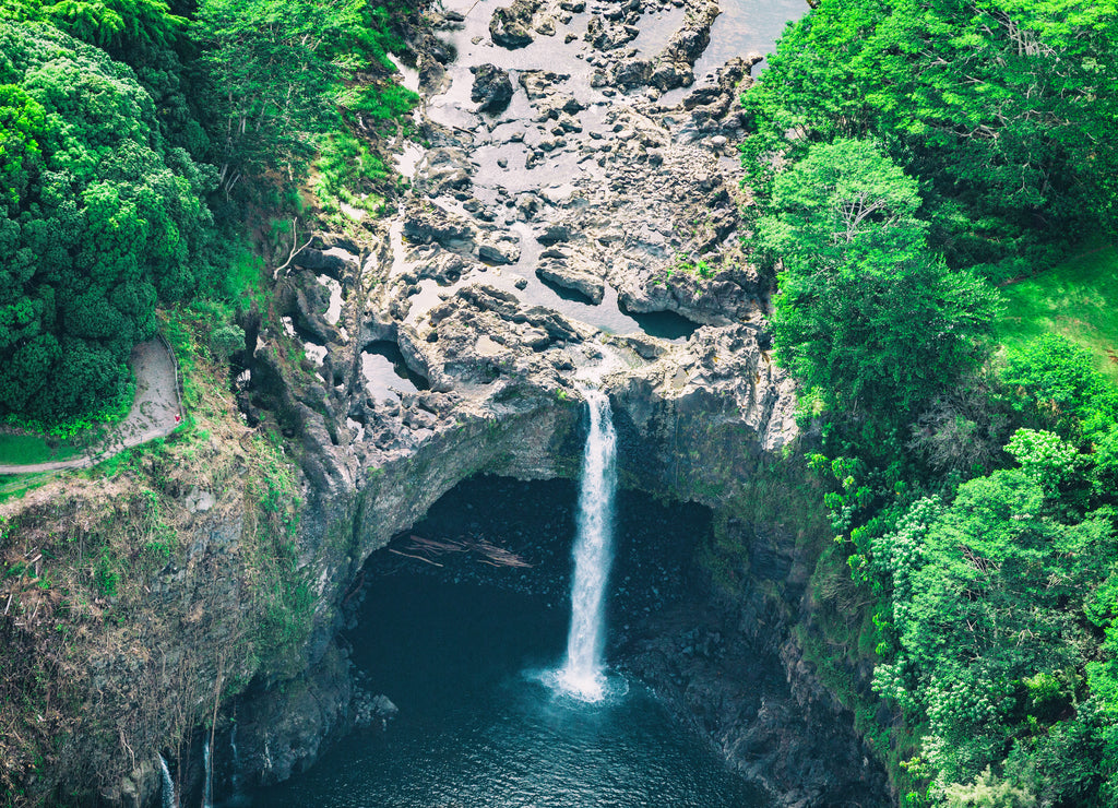 Hawaii Rainbow Falls waterfall near Hilo, Big Island. USA travel. Aerial top view from helicopter