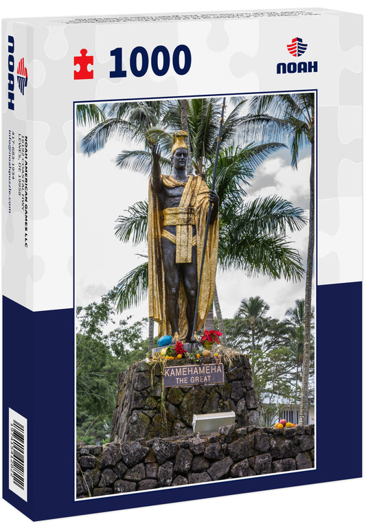 Hilo, Hawaii, USA: Closeup of statue of King Kamehameha, decorated with golden attore amdcrown and long spear under white cloudscape and green trees as backdrop