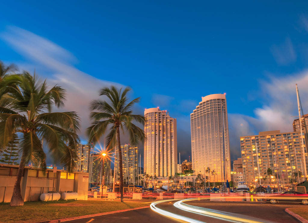 Luxurious hotels overlooking the Ala Wai Harbor at twilight and the light trails in Honolulu, Oahu, Hawaii