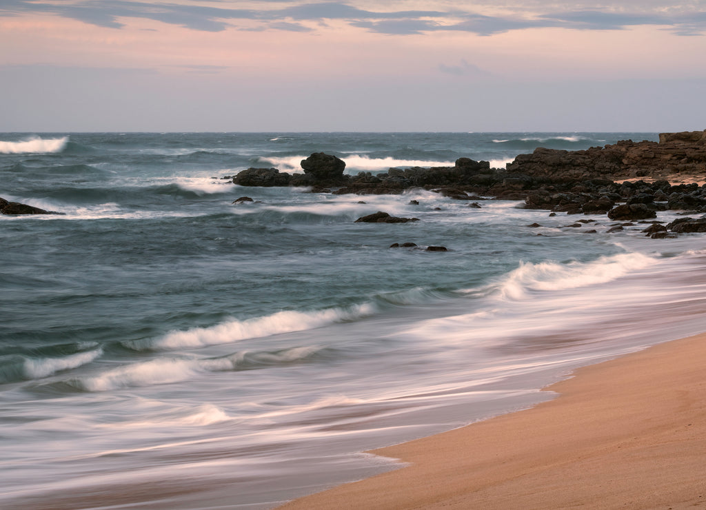 Long exposure of waves crashing on a beach. Image taken on the island of Molokai, Hawaii