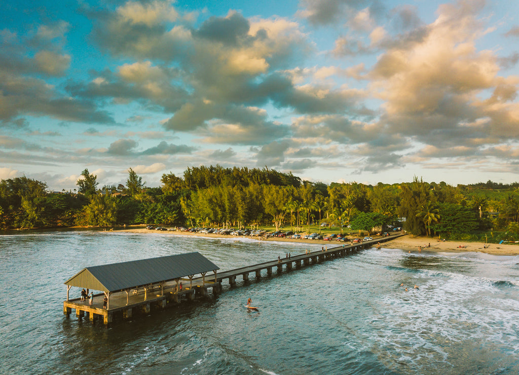 golden sunset over Hanalei pier in Hawaii