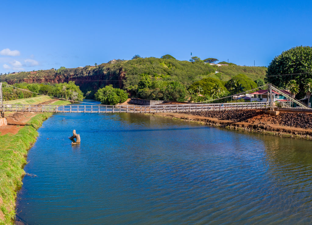 Aerial drone view of the wooden swinging bridge of Hanapepe over the river on Kauai Hawaii