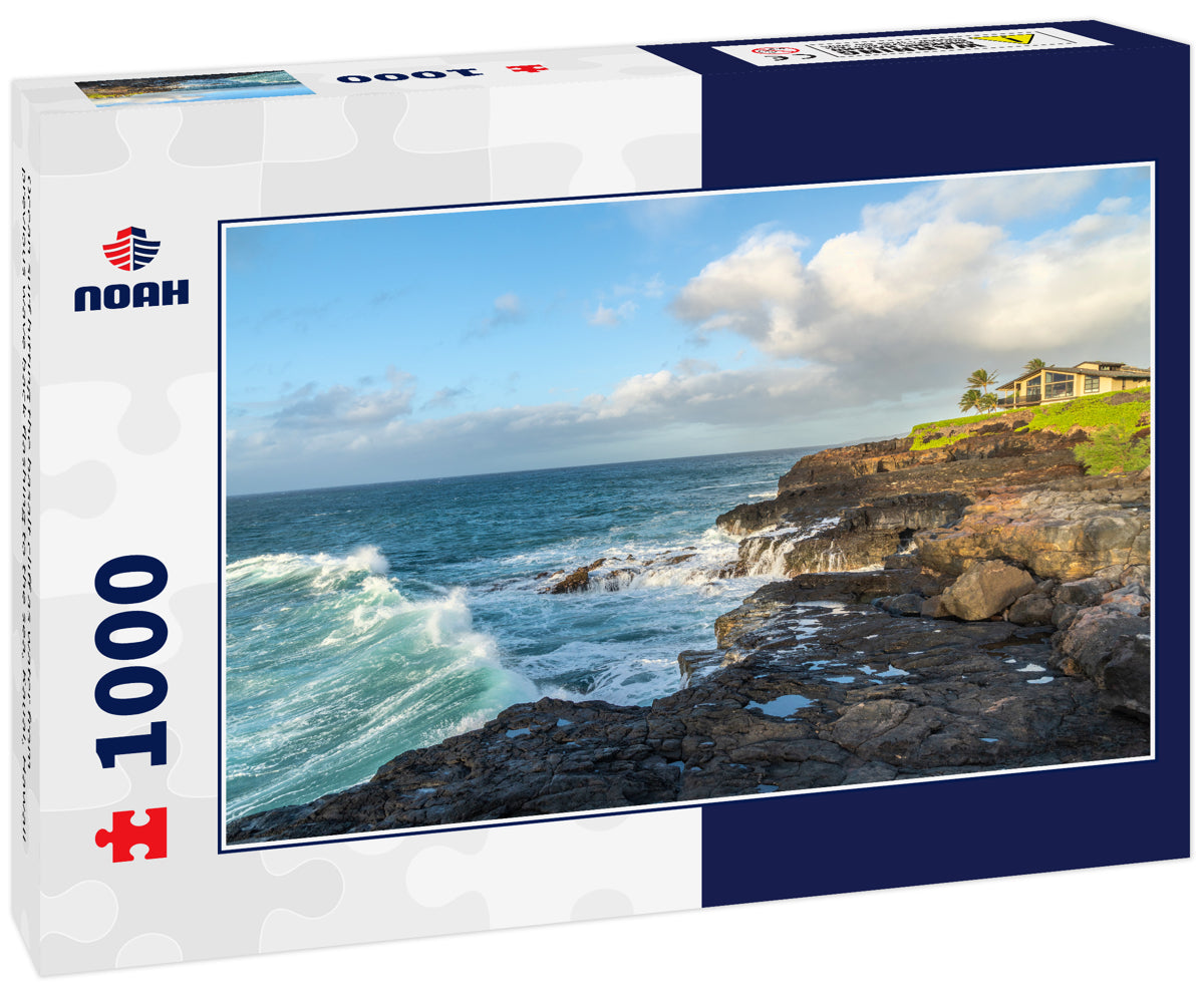 Ocean surf hitting the basalt cliff as water from previous wave back flashing to the sea, Kauai, Hawaii