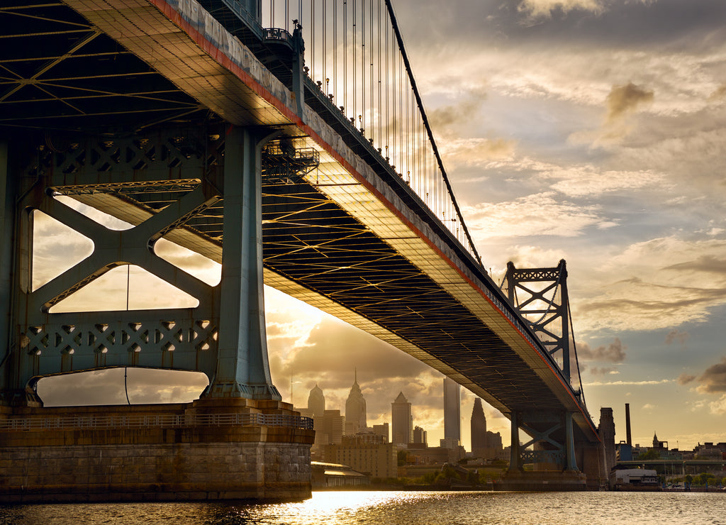 Ben Franklin Bridge above Philadelphia skyline at sunset, US