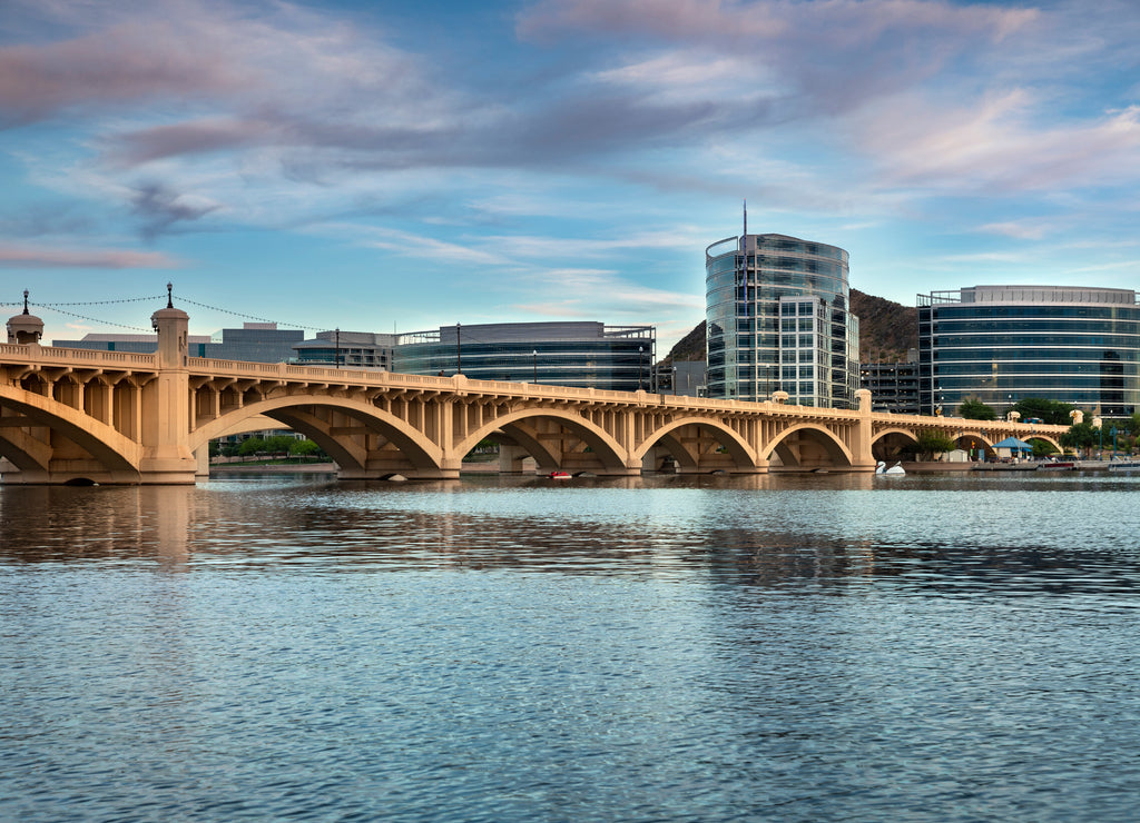 Phoenix, Arizona: Cityscape shore view of downtown Tempe Arizona USA over the Salt River and Mill Avenue Bridge