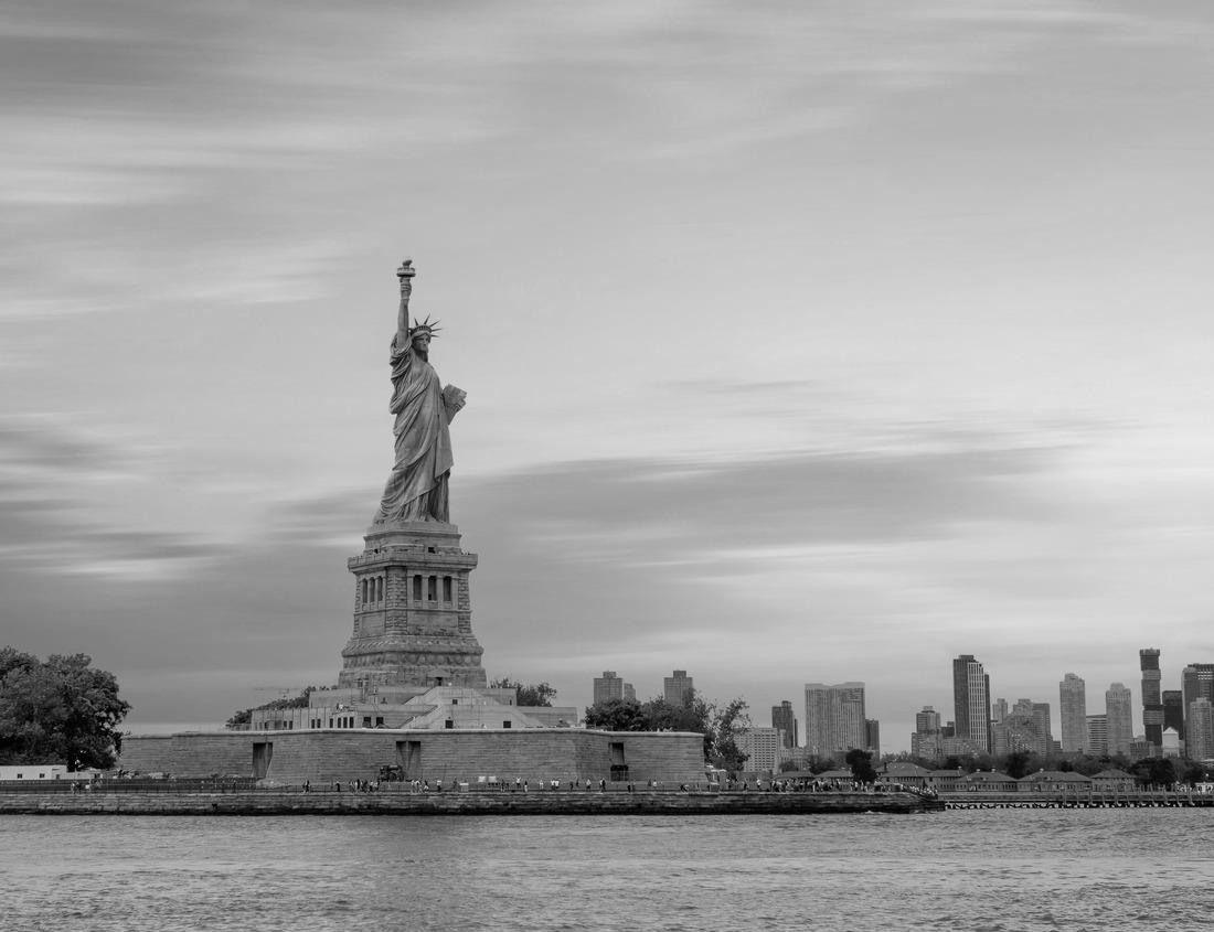 Noah Jigsaw Puzzle Chioggia cityscape with narrow water channel Vena with colorful boats between old buildings and brick bridge, blue sky background in summer, Veneto region, northern Italy in black white 1000 pieces