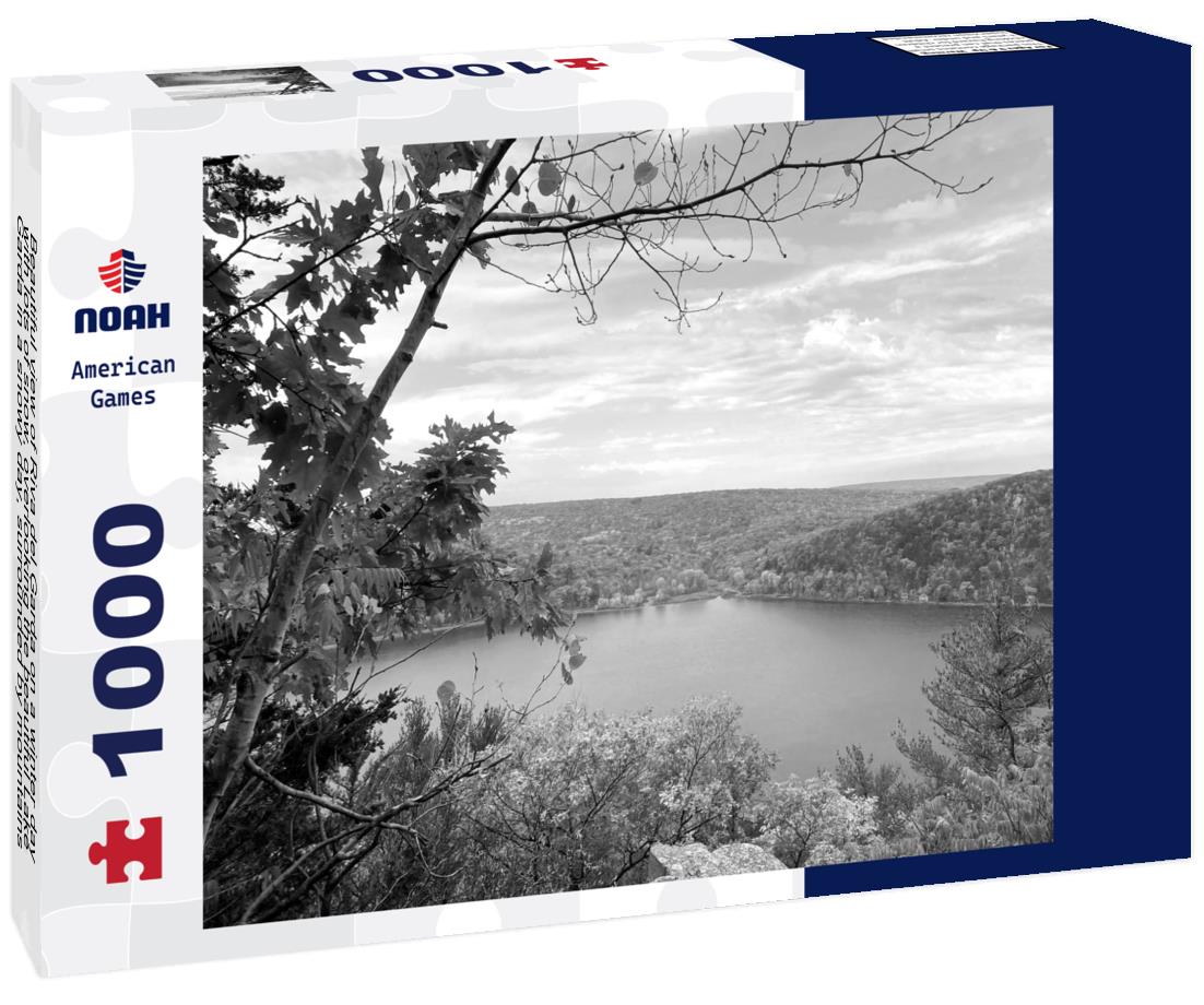 Noah Jigsaw Puzzle Beautiful view of Riva del Garda on a winter day with lots of snow, overlooking the beautiful Lake Garda in a snowy day, surrounded by mountains, Trentino Alto Adige region in black white 1000 pieces